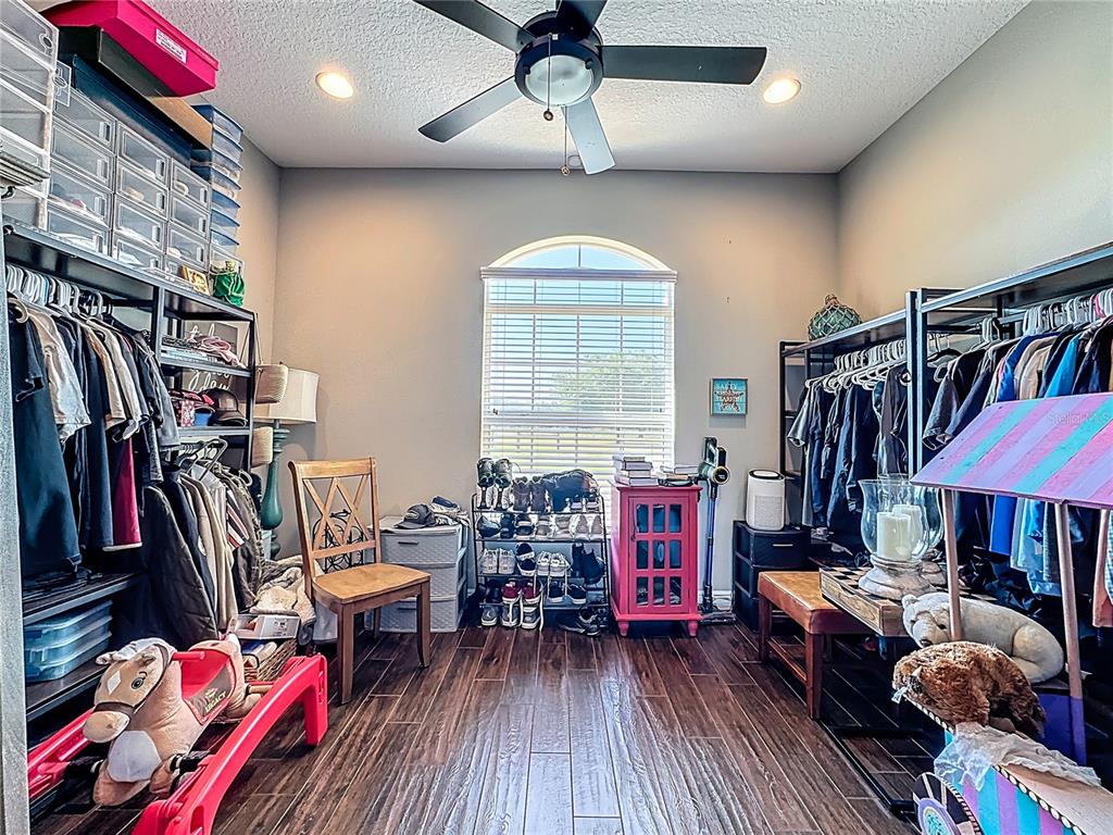 2350 Virgil Hall Road Lithia, FL 33547 - Photo 42 of 52 a living room with lots of furniture and a flat screen tv