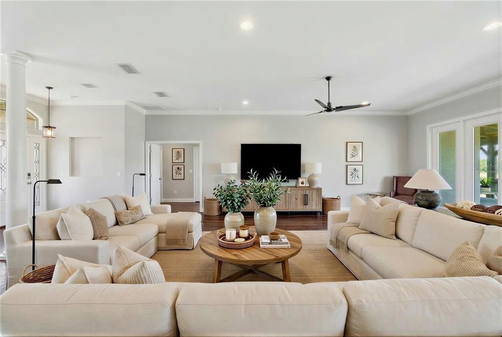 2350 Virgil Hall Road Lithia, FL 33547 - Photo 6 of 52 a living room with furniture and a large mirror