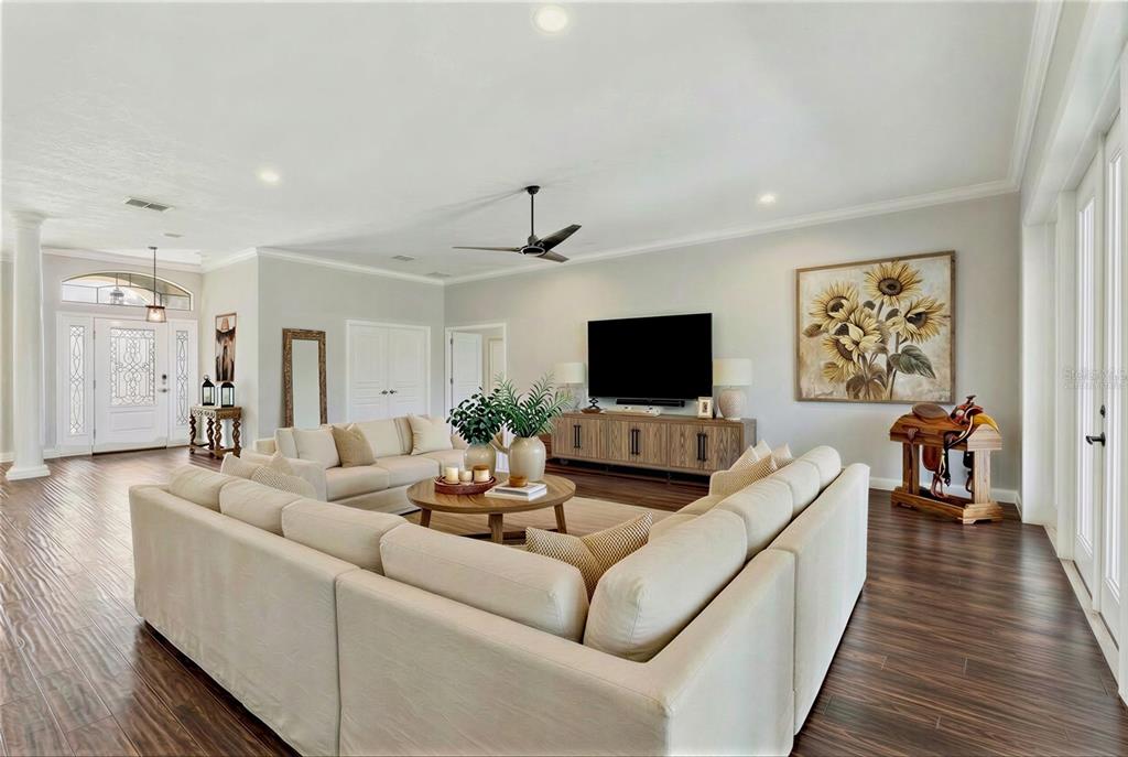 2350 Virgil Hall Road Lithia, FL 33547 - Photo 7 of 52 a living room with furniture and a flat screen tv