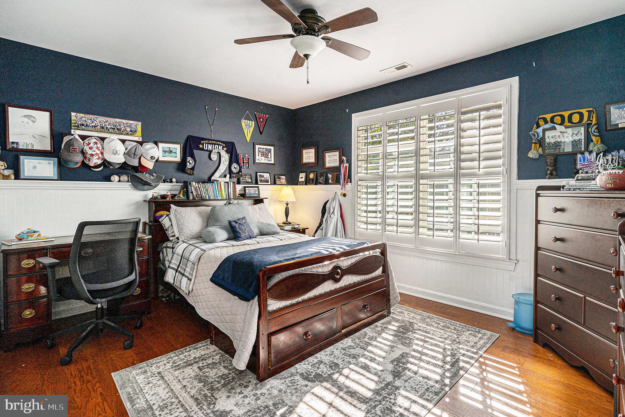 1250 Appalachian Road Ambler, PA 19002 - Photo 32 of 58 a bedroom with a bed and wooden floor