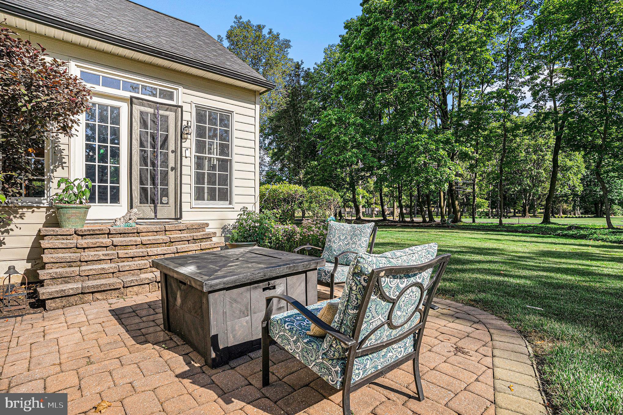 1250 Appalachian Road Ambler, PA 19002 - Photo 45 of 58 a view of a chairs and table in backyard of the house