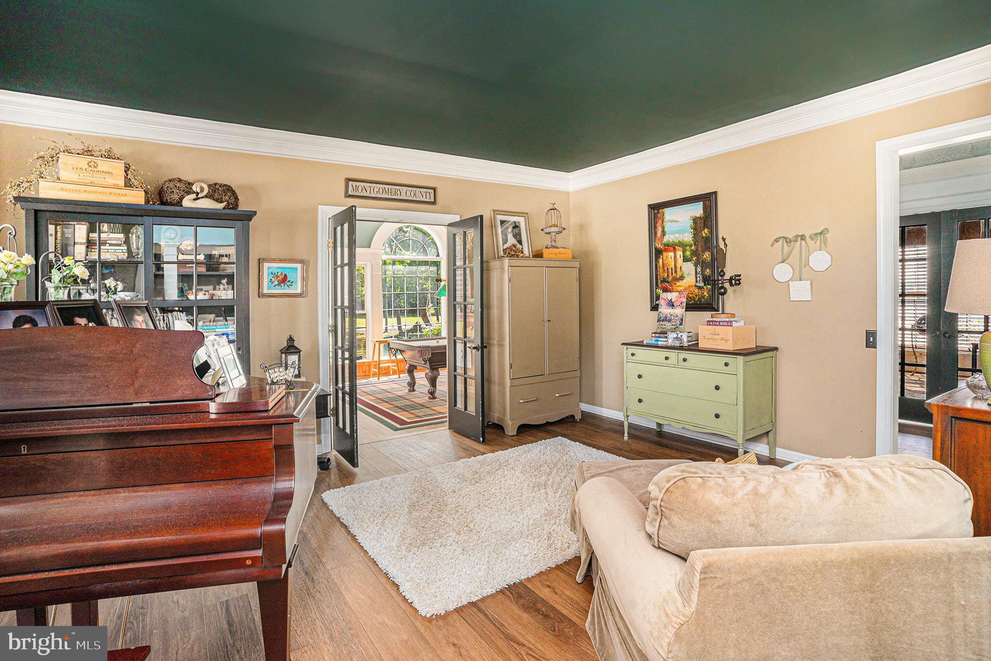 1250 Appalachian Road Ambler, PA 19002 - Photo 6 of 58 a living room with a couch and a dresser next to a window