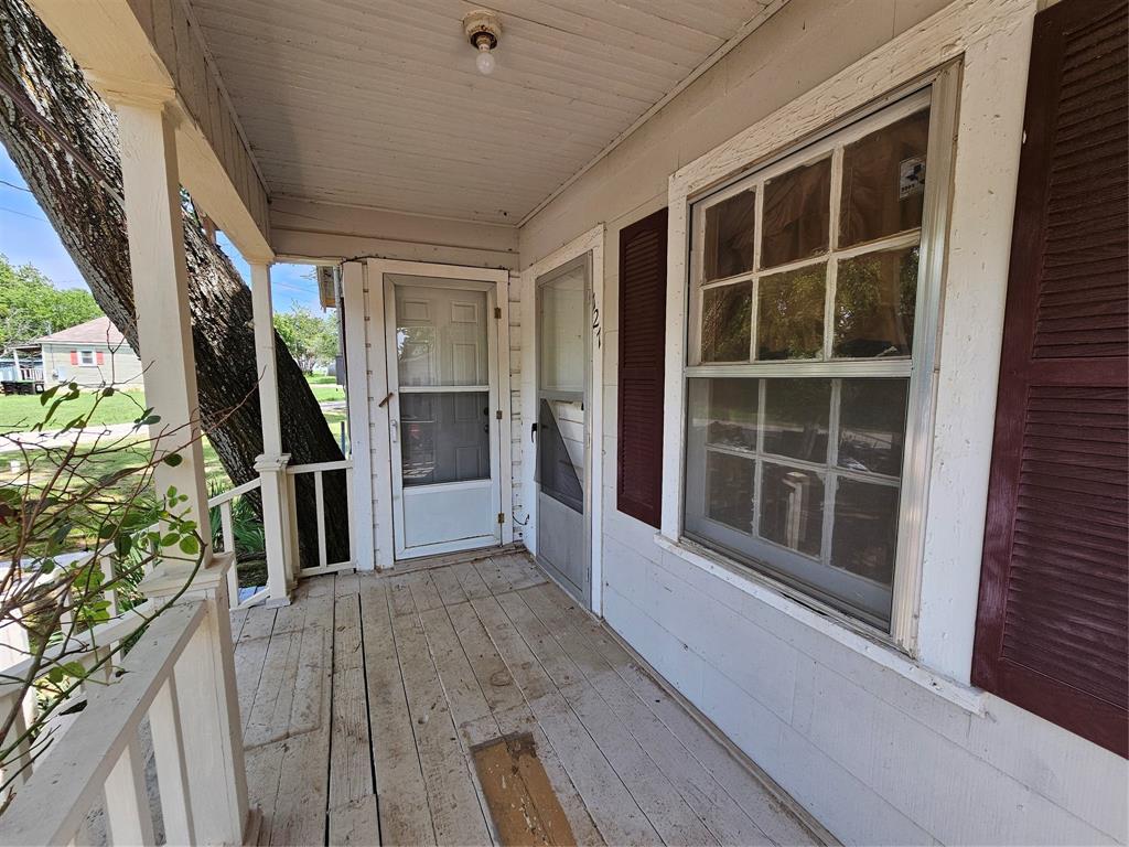 127 East Morgan Street Pilot Point, TX 76258 - Photo 10 of 25 View of wooden porch