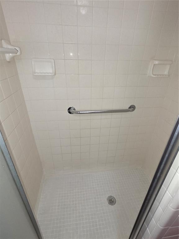 8071 Highpoint Boulevard Brooksville, FL 34613 - Photo 11 of 21 a bathroom with a shower