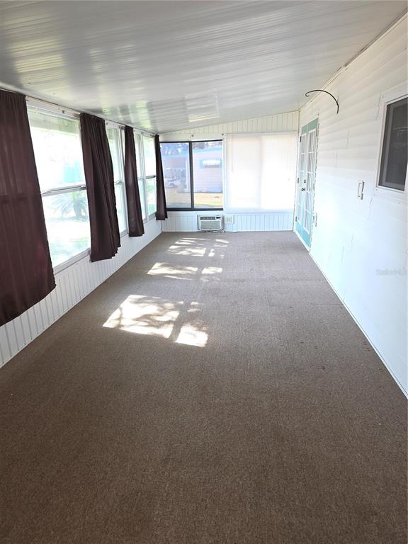 8071 Highpoint Boulevard Brooksville, FL 34613 - Photo 18 of 21 a view of empty room with windows