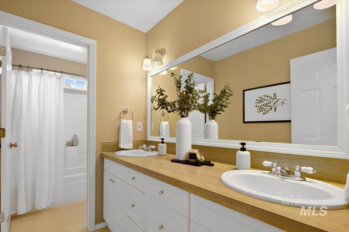 1075 North Purple Sage Way Eagle, ID 83616 - Photo 32 of 44 Bathroom featuring double vanity and shower / tub combo