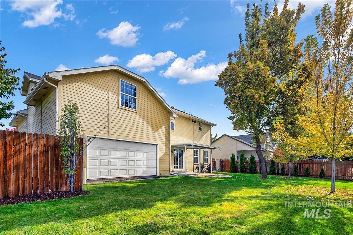 1075 North Purple Sage Way Eagle, ID 83616 - Photo 39 of 44 Back of property with a garage and a patio area