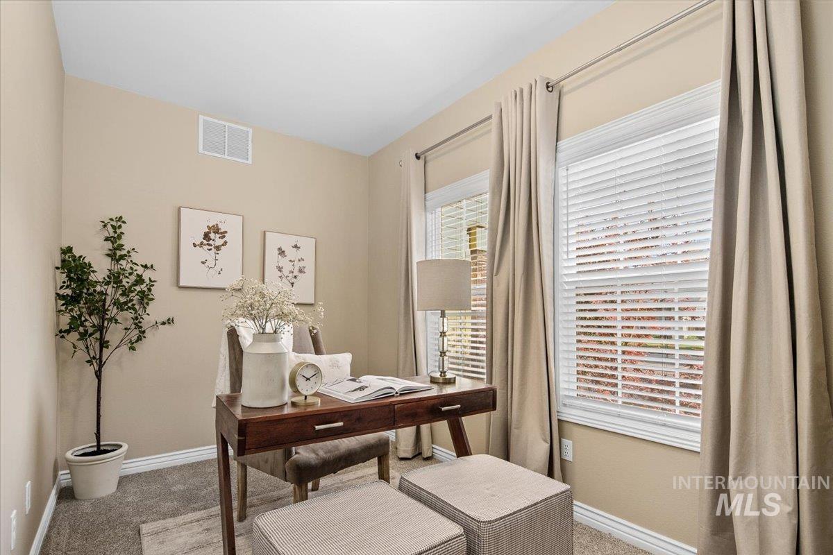 1075 North Purple Sage Way Eagle, ID 83616 - Photo 9 of 44 Carpeted home office featuring baseboards