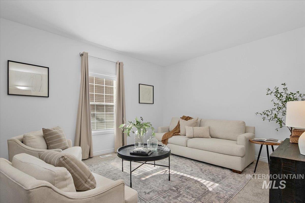 1075 North Purple Sage Way Eagle, ID 83616 - Photo 10 of 44 Living area featuring carpet floors