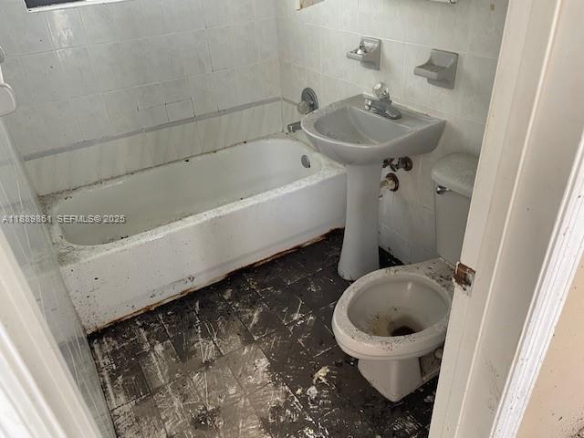 640 83rd Street Miami Beach, FL 33141 - Photo 11 of 13 a bathroom with a toilet and a sink