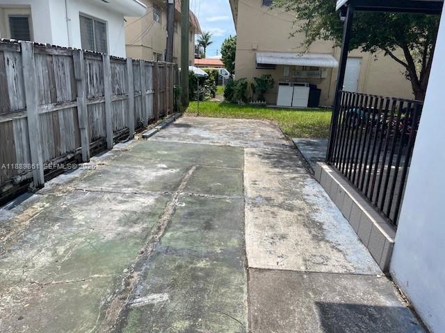 640 83rd Street Miami Beach, FL 33141 - Photo 4 of 13 a view of a backyard with wooden fence