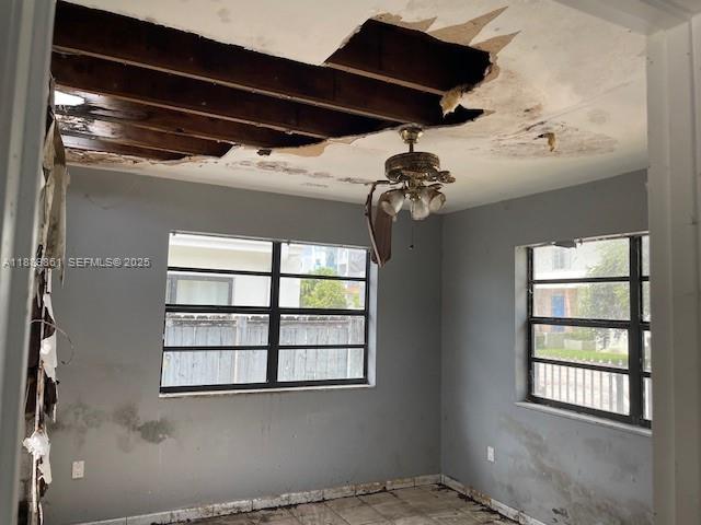 640 83rd Street Miami Beach, FL 33141 - Photo 7 of 13 a view of a living room with a large window