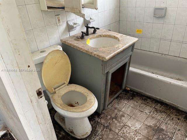 640 83rd Street Miami Beach, FL 33141 - Photo 8 of 13 a bathroom with a sink a toilet and bathtub