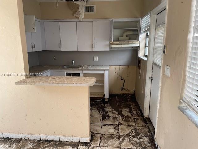640 83rd Street Miami Beach, FL 33141 - Photo 10 of 13 a kitchen with a refrigerator and a stove
