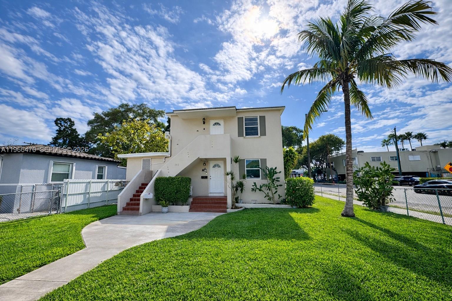 3450 Southwest 7th Street, Unit 3450 Miami, FL 33135 - Photo 1 of 7 a front view of a house with garden