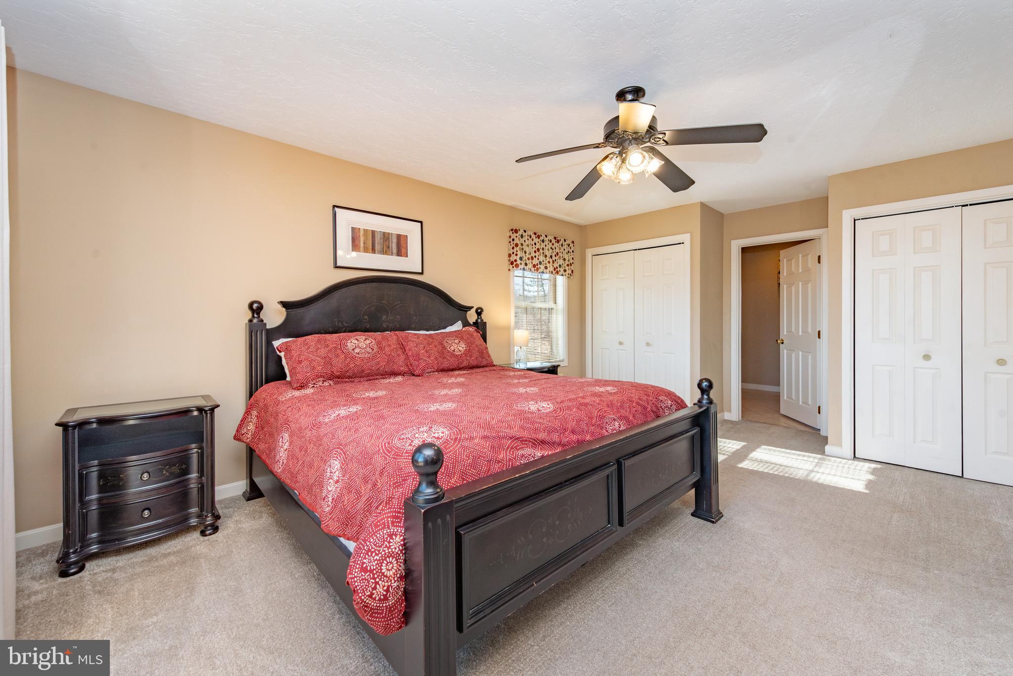 2828 Glendale Road Swanton, MD 21561 - Photo 21 of 78 a bedroom with a bed and a chandelier