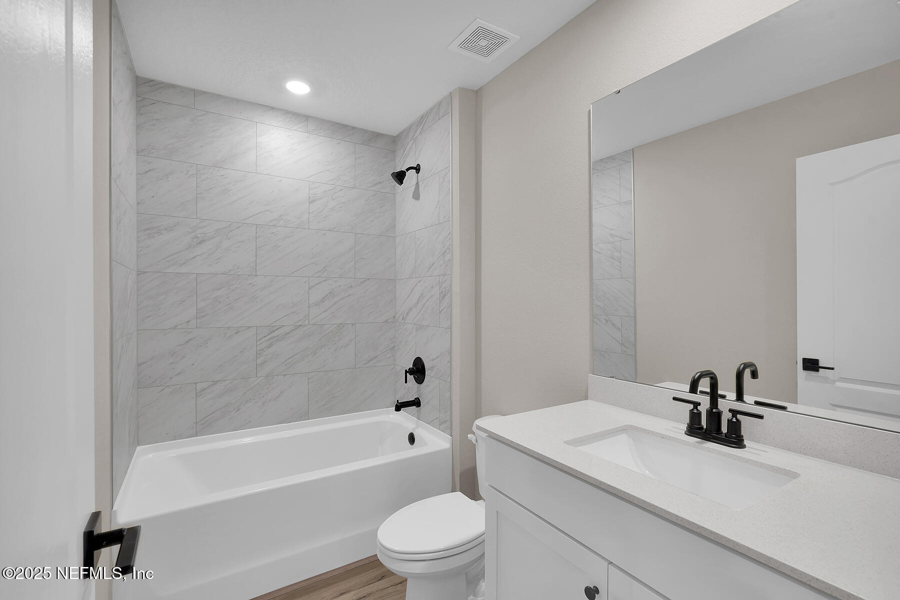 3987 Gareys Ferry Way Middleburg, FL 32068 - Photo 16 of 25 a bathroom with a sink a toilet and a bathtub