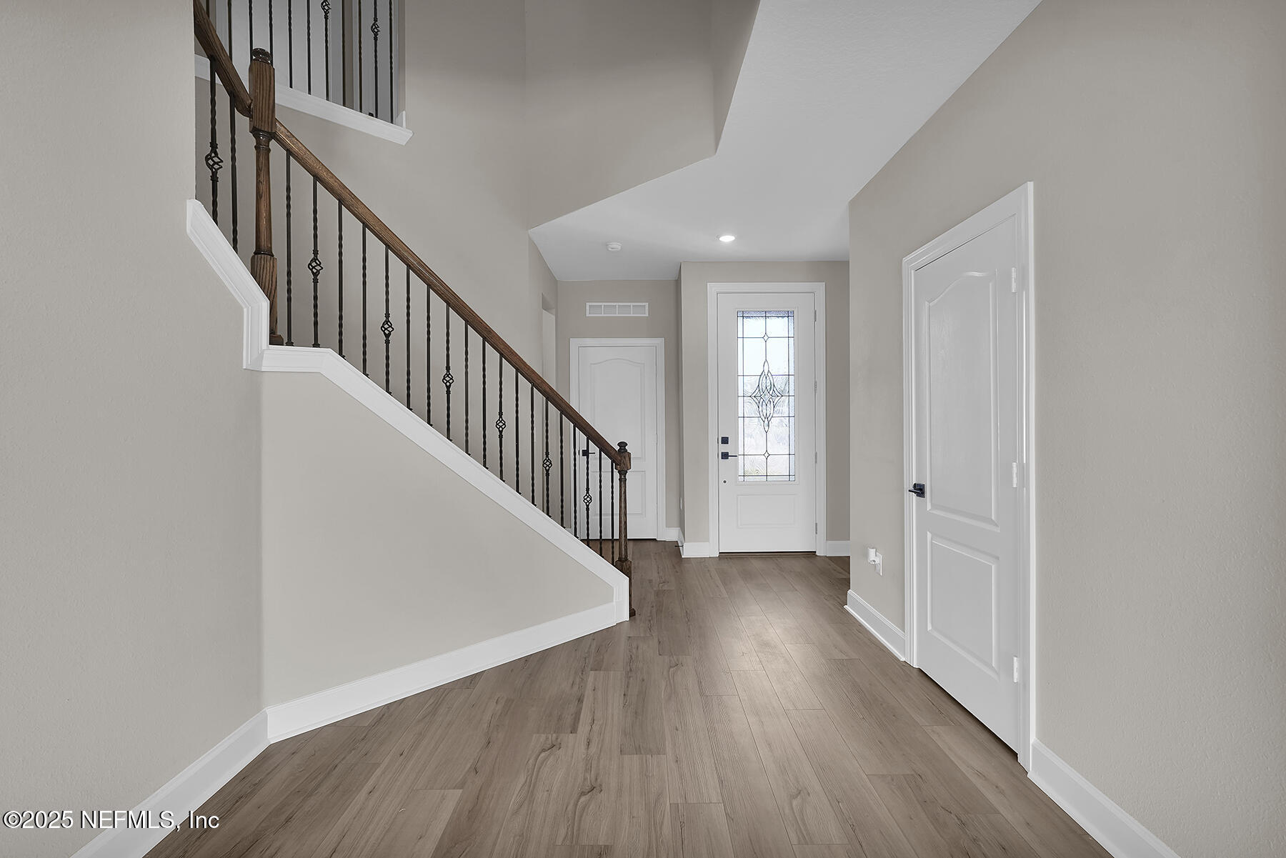 3987 Gareys Ferry Way Middleburg, FL 32068 - Photo 3 of 25 a view of a hallway with wooden floor and entryway