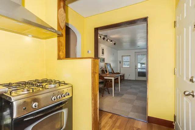 a view of a livingroom with furniture and a window