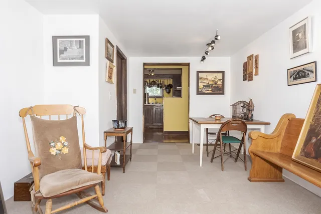 a living room with furniture and a chair