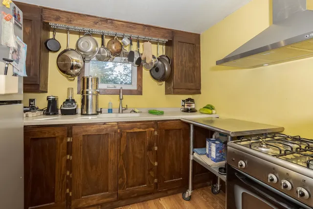 a kitchen with a stove and a sink