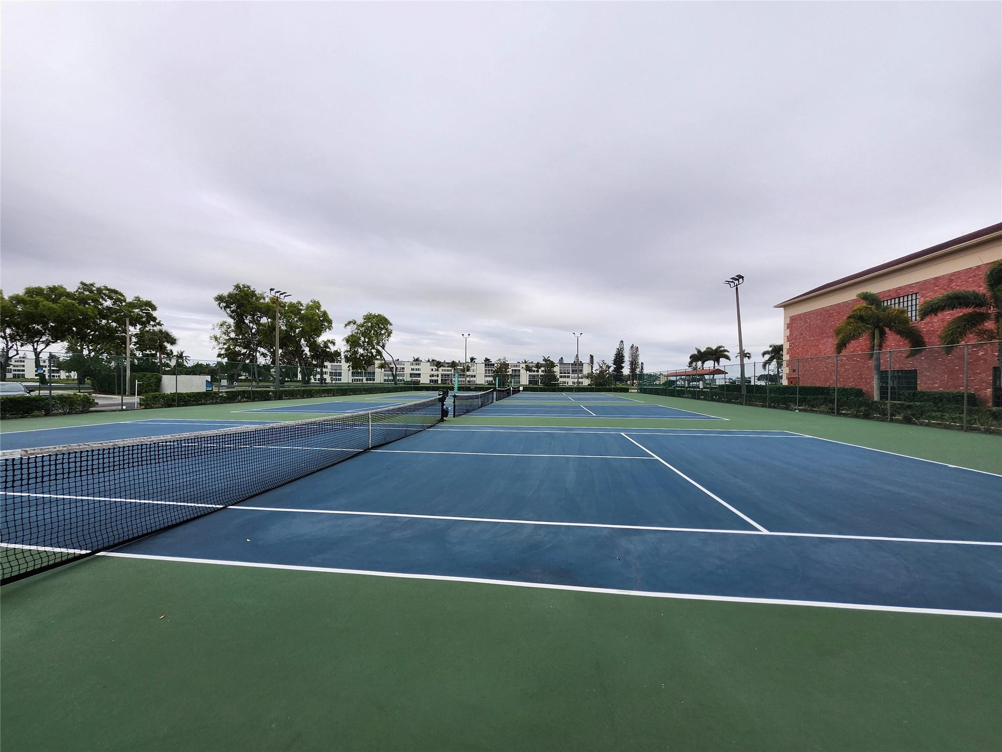 74 Preston Way Boca Raton, FL 33434 - Photo 26 of 28 a view of an outdoor space and tennis court