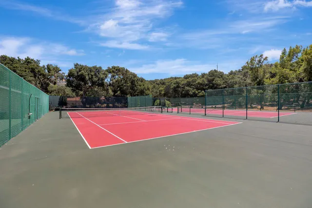 a view of a street with a building in the background