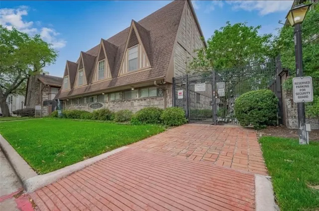 a brick building with a yard