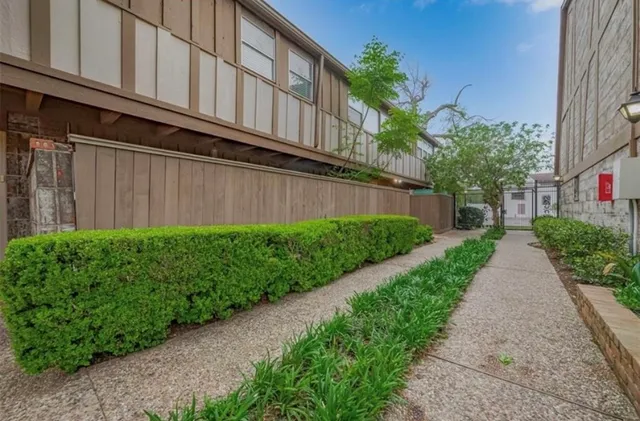 a view of a pathway with a house in background
