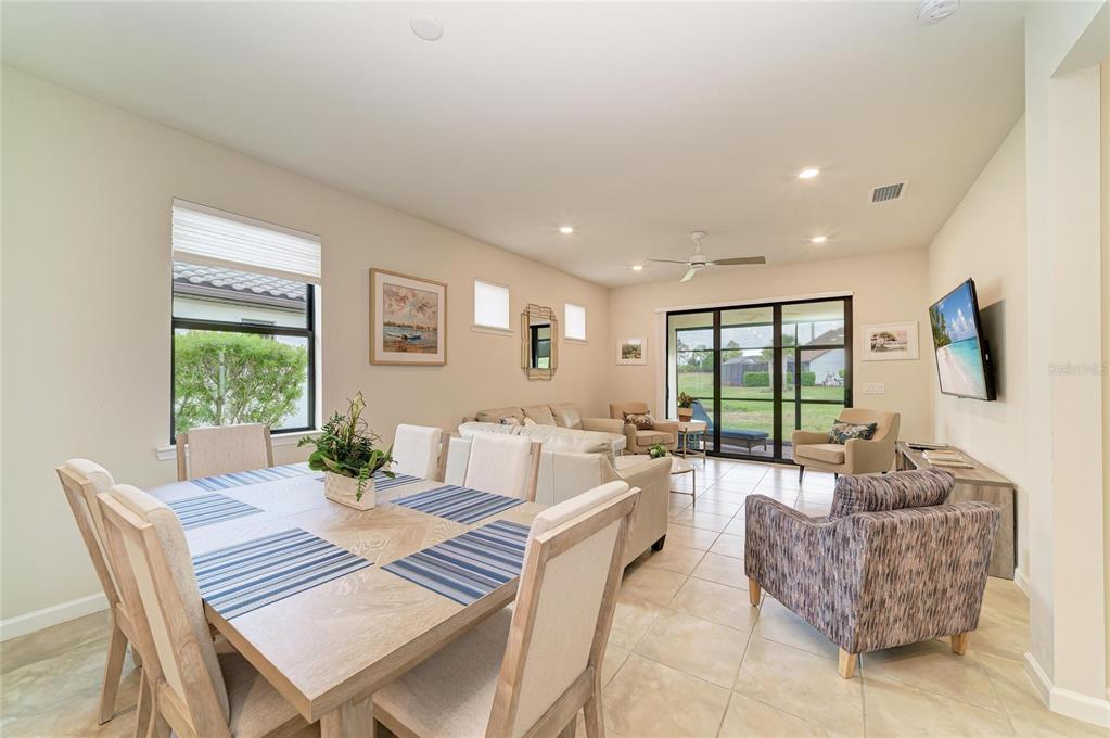 7013 Hanover Court Lakewood Ranch, FL 34202 - Photo 18 of 64 a living room with furniture and a flat screen tv
