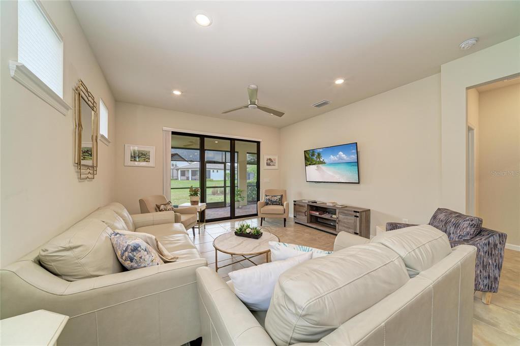 7013 Hanover Court Lakewood Ranch, FL 34202 - Photo 22 of 64 a living room with furniture and a large window