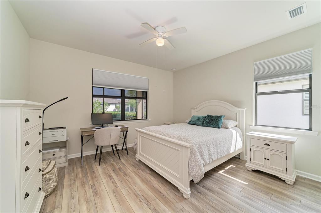 7013 Hanover Court Lakewood Ranch, FL 34202 - Photo 26 of 64 a bedroom with a large bed and a window