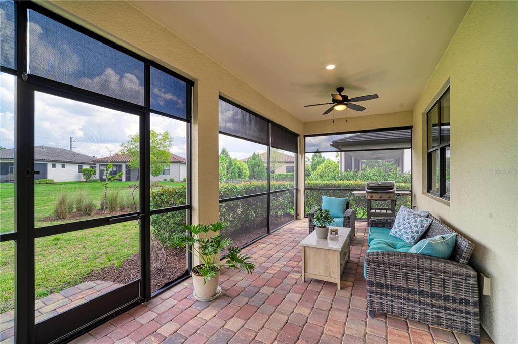 7013 Hanover Court Lakewood Ranch, FL 34202 - Photo 39 of 64 a living room with furniture and a large window