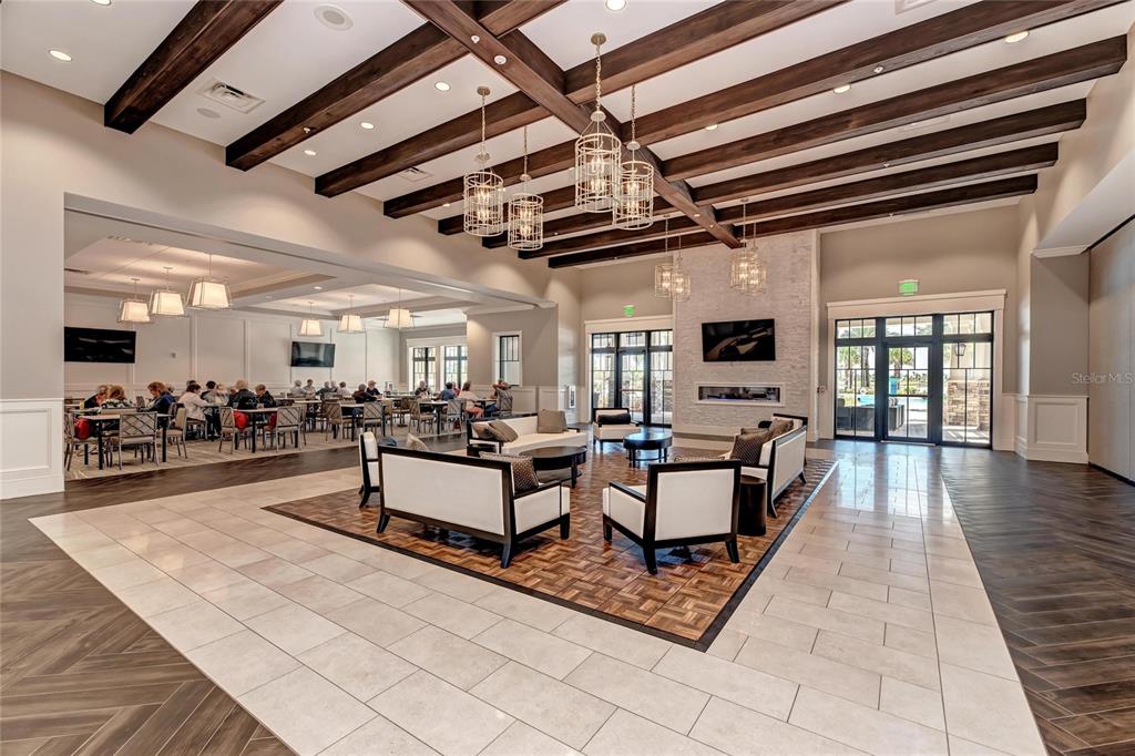 7013 Hanover Court Lakewood Ranch, FL 34202 - Photo 53 of 64 a living room with lots of furniture and a view of kitchen