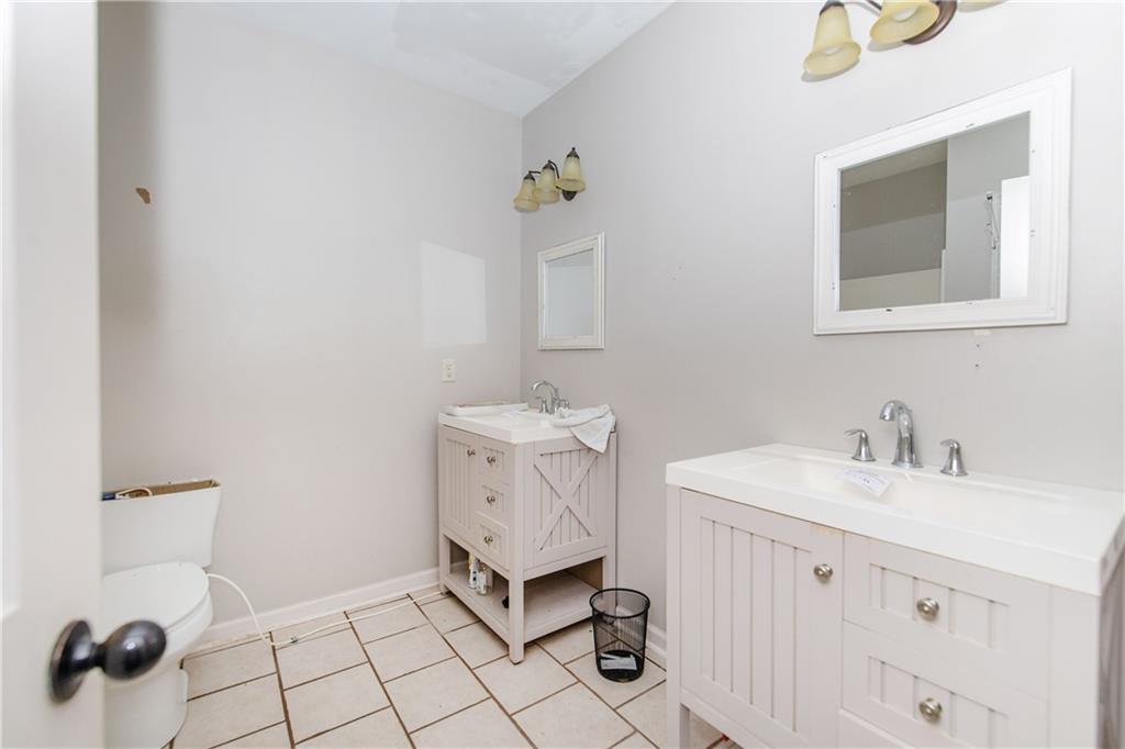 561 Holland Road Dallas, GA 30157 - Photo 34 of 48 a bathroom with a sink toilet and mirror