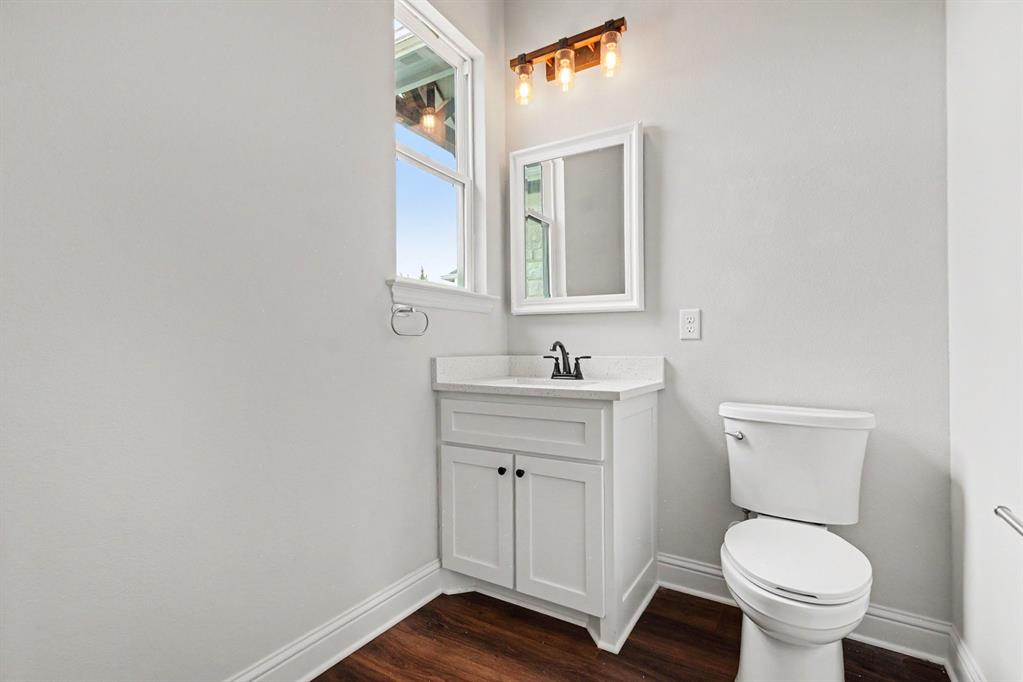 530 P R 491 Leonard, TX 75452 - Photo 27 of 35 Bathroom featuring a white vanity with shaker-style cabinetry, a white countertop, and a rectangular sink