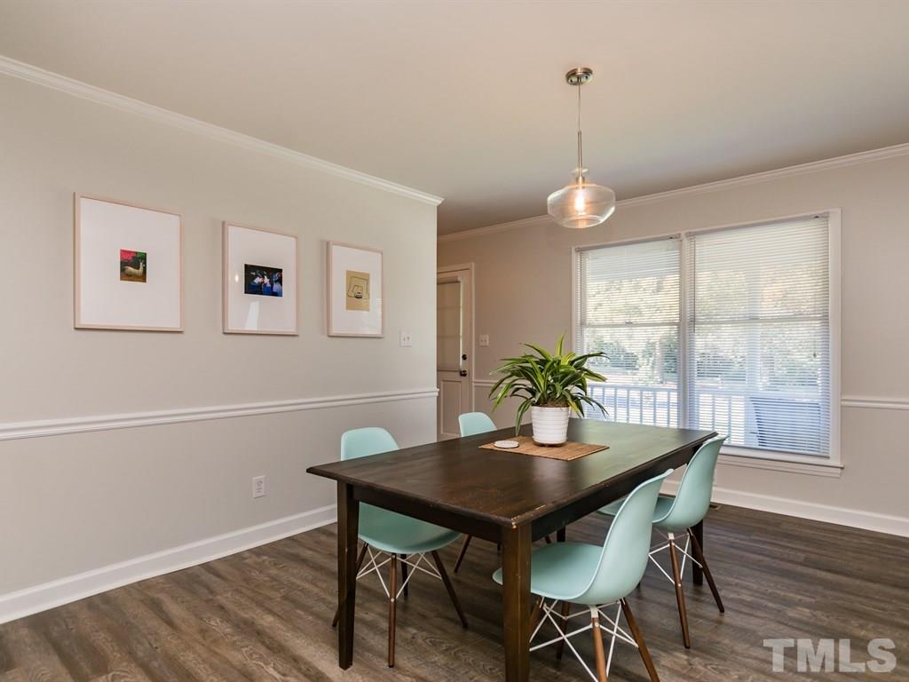 4104 Wingate Drive Raleigh, NC 27609 - Photo 8 of 24 a view of a dining room with furniture window and wooden floor