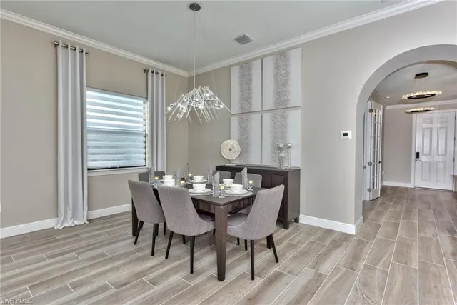 a view of a dining room with furniture and window