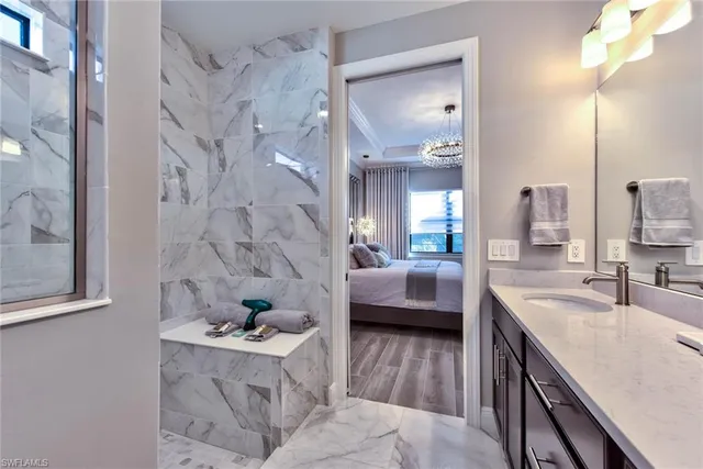 a bathroom with a tub sink and mirror