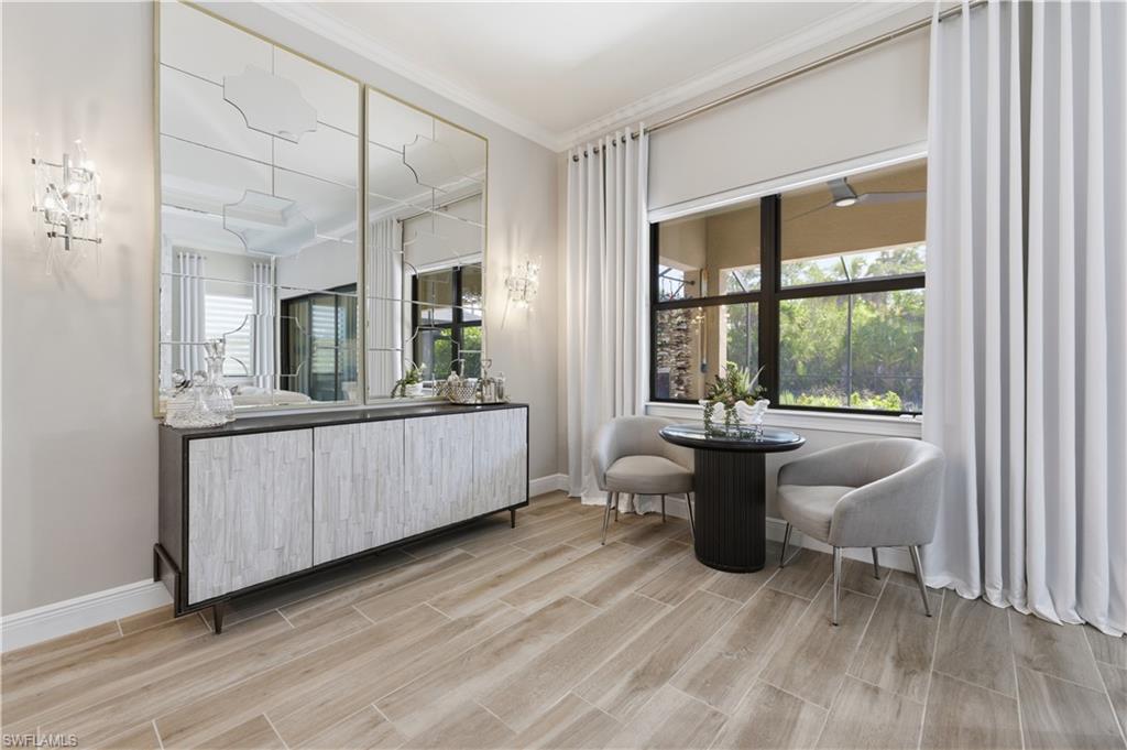 9761 Willet Court Naples, FL 34120 - Photo 24 of 44 a bathroom with a sink mirror and window