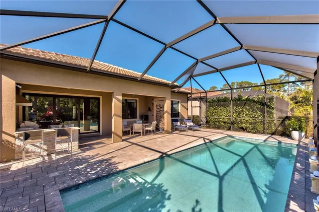 a view of a backyard with sitting area