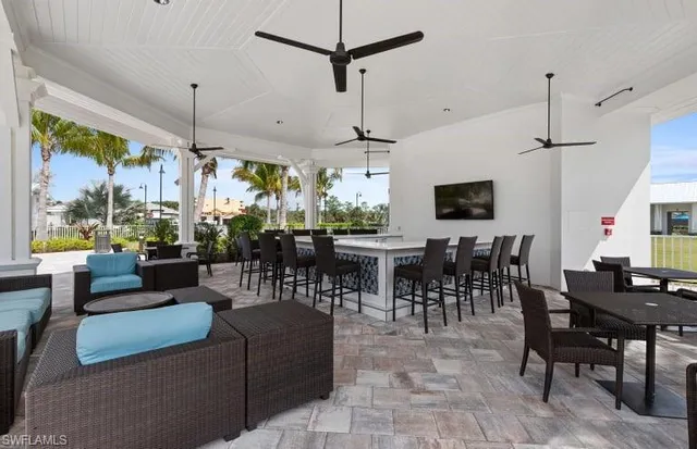 a living room with lots of furniture and a chandelier