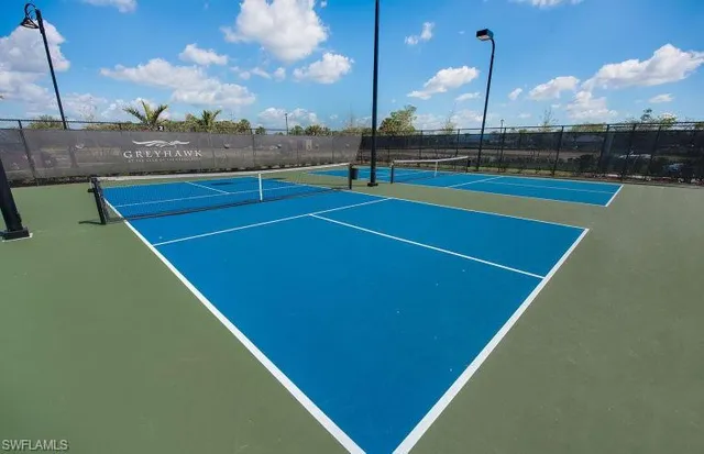 a view of an outdoor space and tennis court