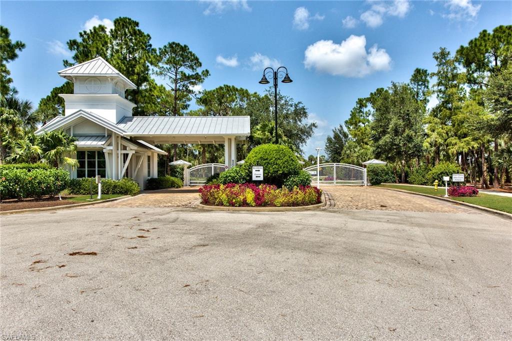 9761 Willet Court Naples, FL 34120 - Photo 40 of 44 a view of a street with houses