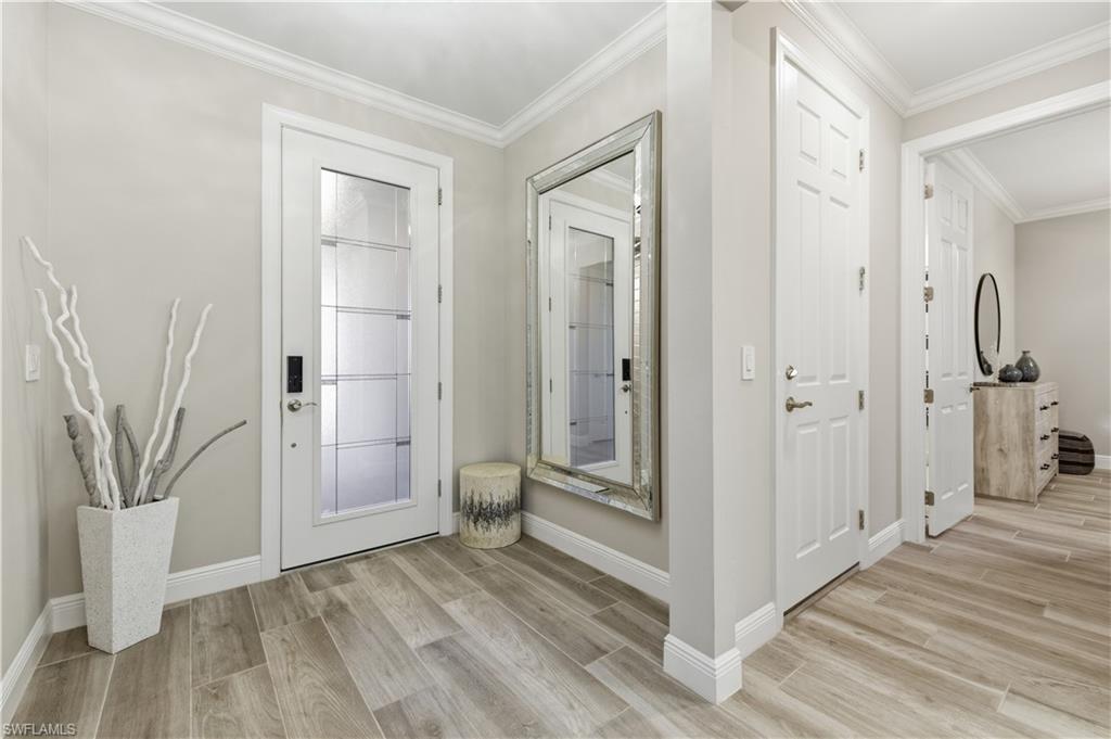 9761 Willet Court Naples, FL 34120 - Photo 5 of 44 a view of a bathroom with a glass door shower