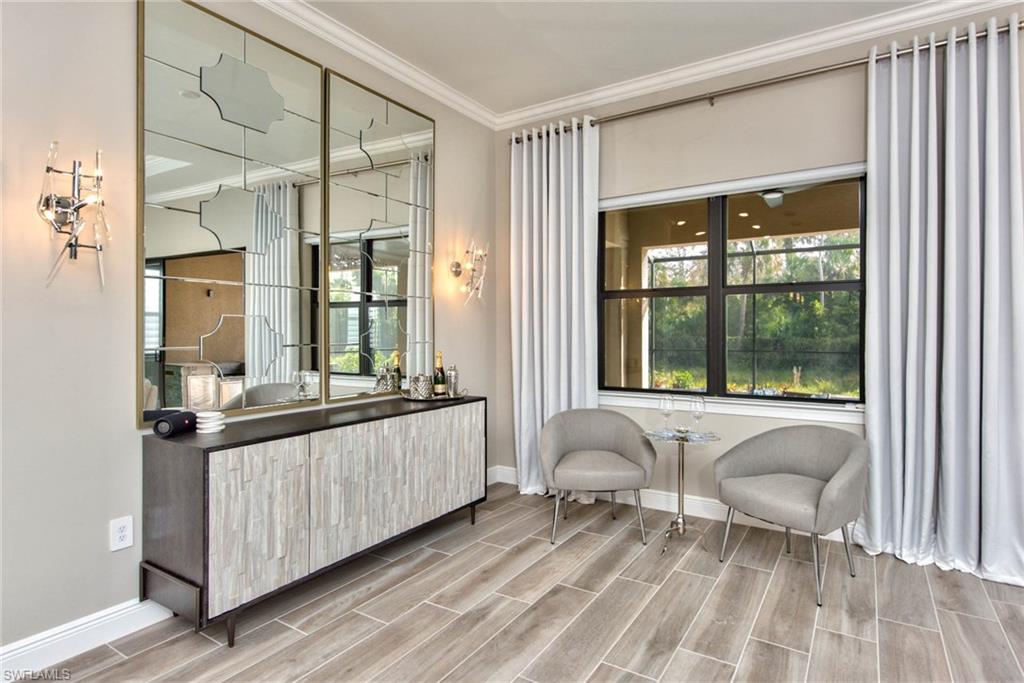 9761 Willet Court Naples, FL 34120 - Photo 10 of 34 a living room with a bed furniture and next to a window