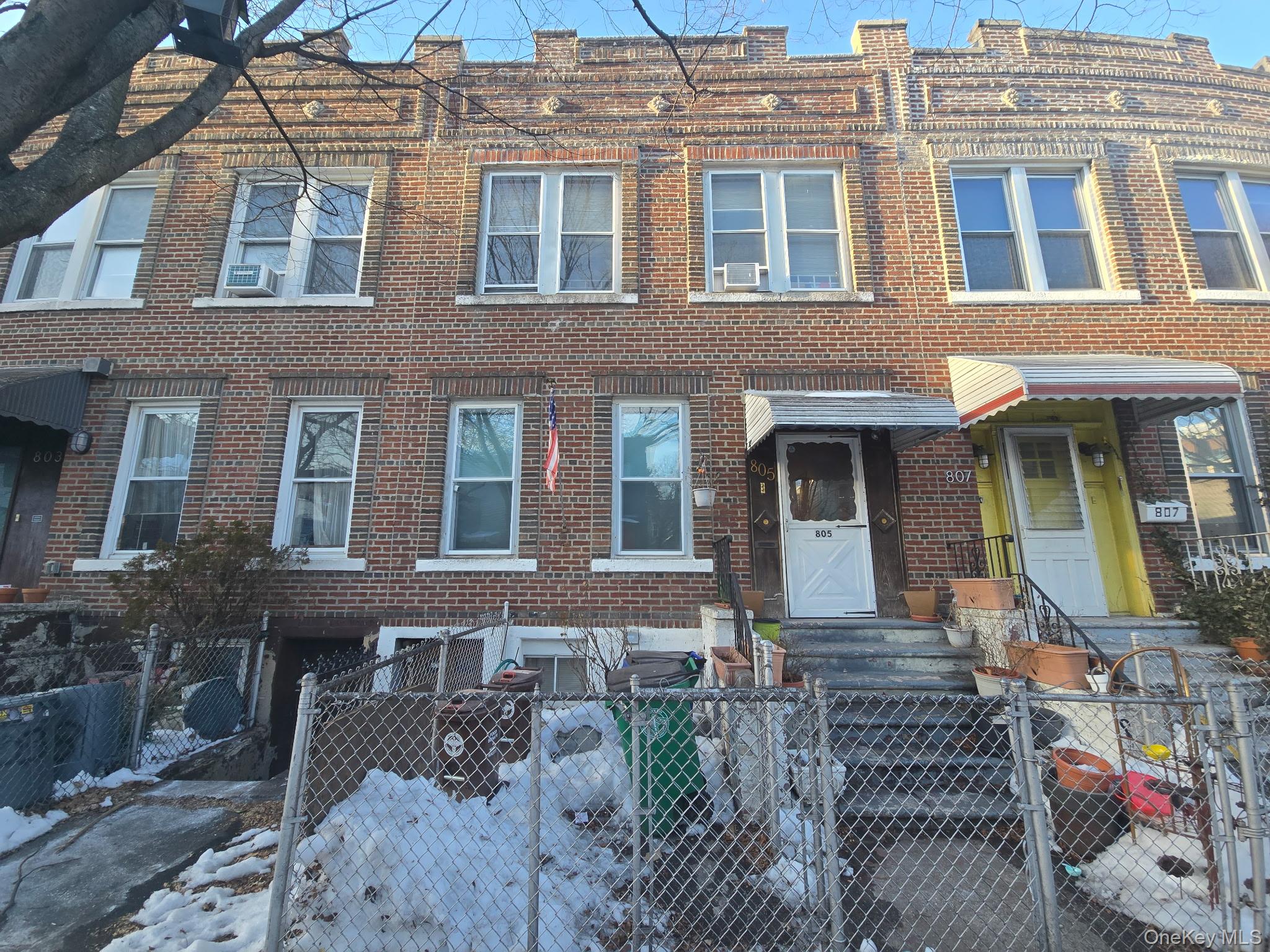 a front view of a house with many windows