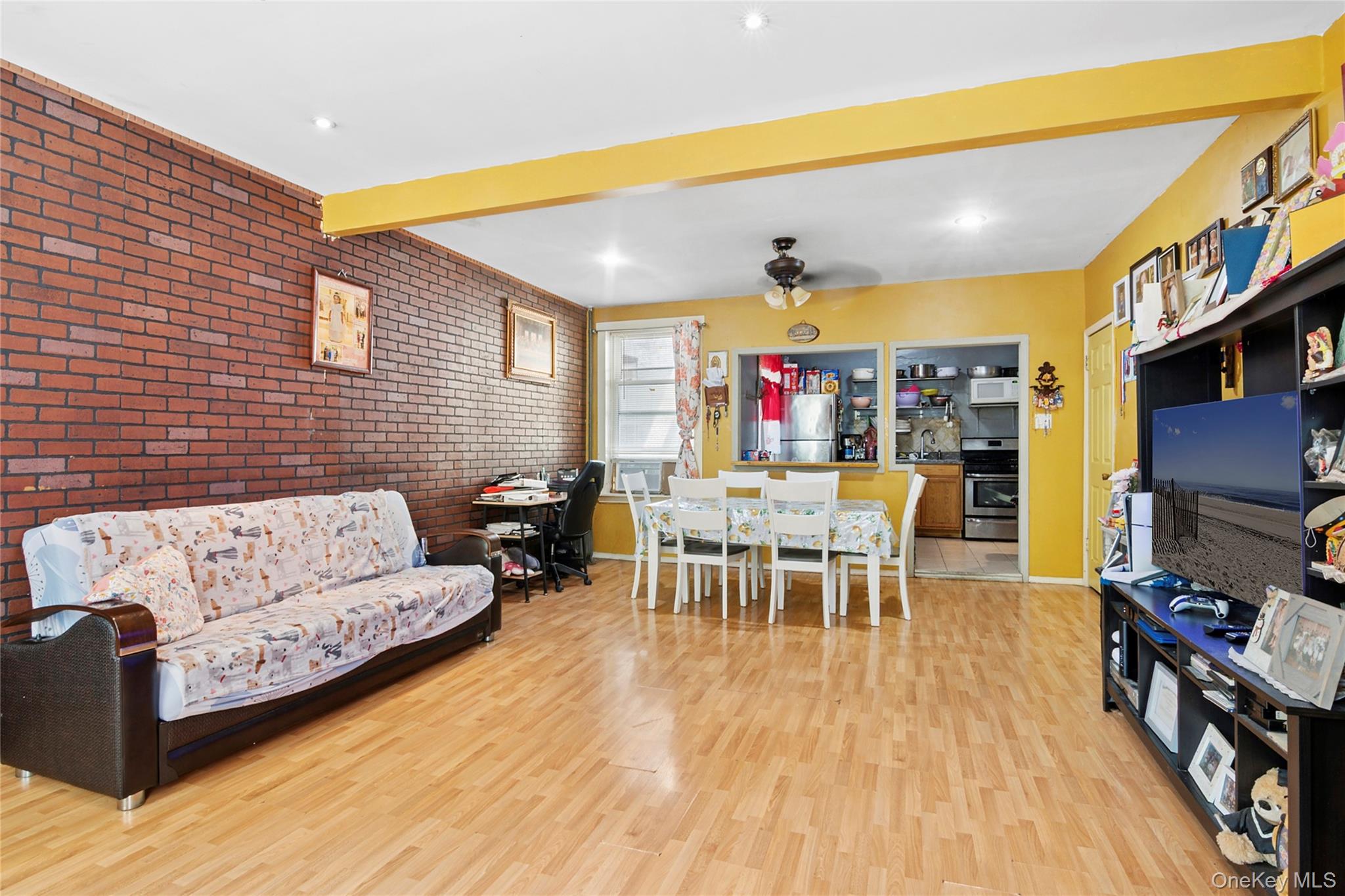 809 Friel Place Brooklyn, NY 11218 - Photo 4 of 19 a living room with furniture and a flat screen tv