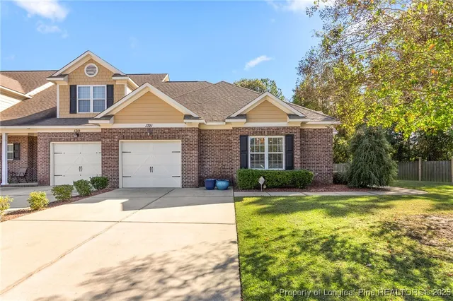 a front view of a house with swimming pool and porch