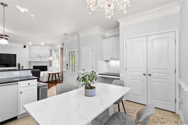 a kitchen with a table and chairs in it